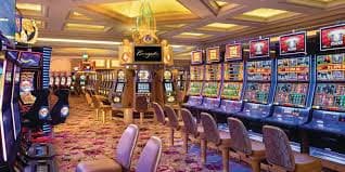 Jurassic Kingdom slot game interface showing dinosaur symbols and payline highlights on tajir365 login